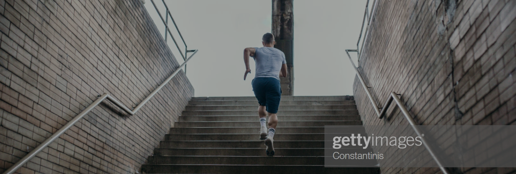 man running up steps