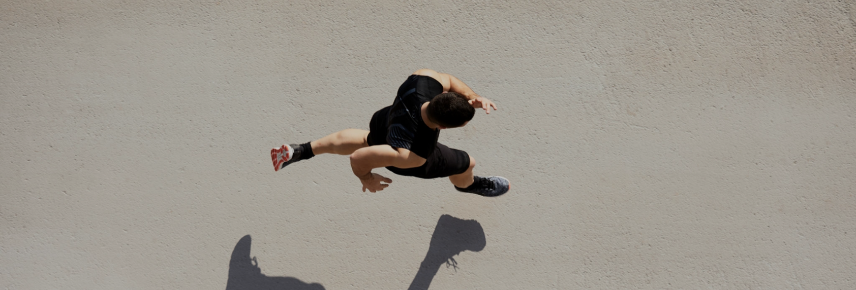 man running ariel view